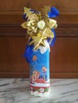 Botella  decorada con servilleta, nieve y motivos navideños